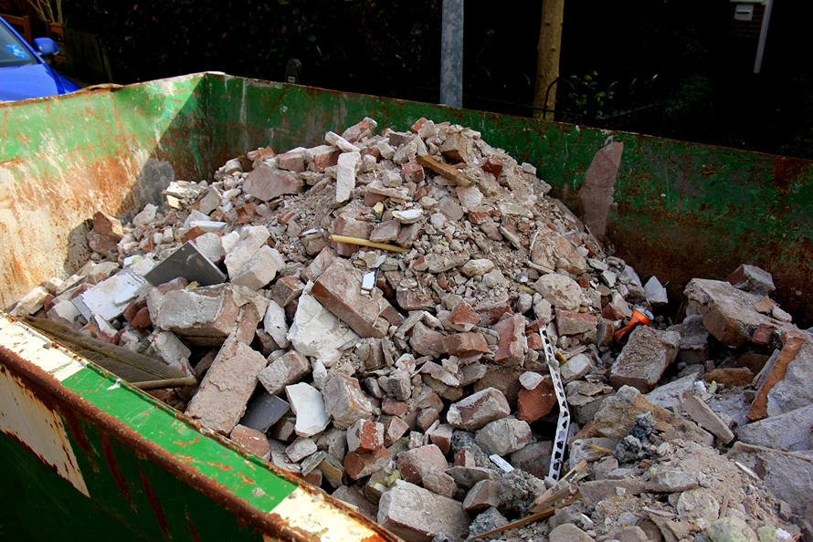 How much concrete or asphalt can you put in a 20-yard dumpster?